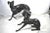 A large pair of 1960s bronze greyhounds in dominance stance. Beautiful sculpted and cast pair of near life size male and...