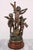 A trio of statues with a total of five angels on wooden bases. Bronze patina. The statues are made of metal from a zinc-...