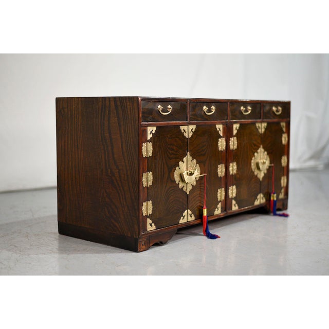 A pair of vintage Chinoiserie style storage chests in wood, fitted with etched brass Asian-inspired hardware. Exceptional...