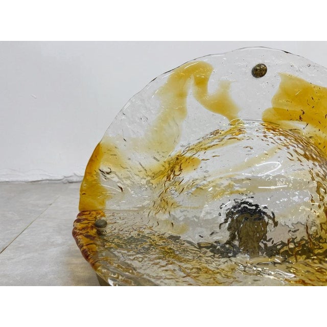 These wall lamps are a perfect example of 1970s Italian design, a period characterized by organic shapes, innovative...