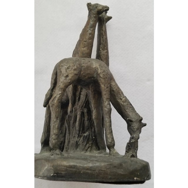 We love this extraordinary chalkware or plaster sculpture of two giraffe parents with baby for the condition, detail and...