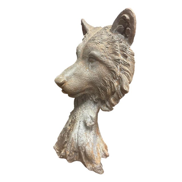 This striking vintage cast iron statue captures the commanding and noble presence of a wolf in a finely detailed bust...