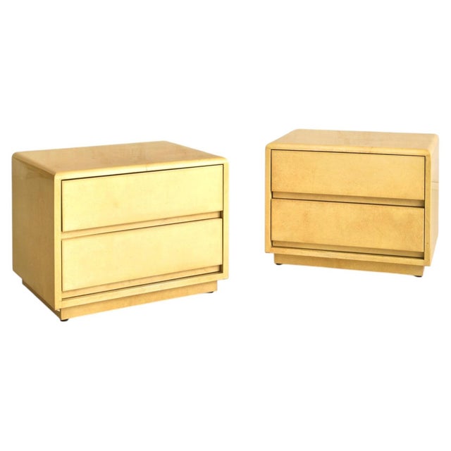 A 1960s Italian lacquered goatskin nightstand by Aldo Tura, wrapped in his signature parchment and finished in a warm,...