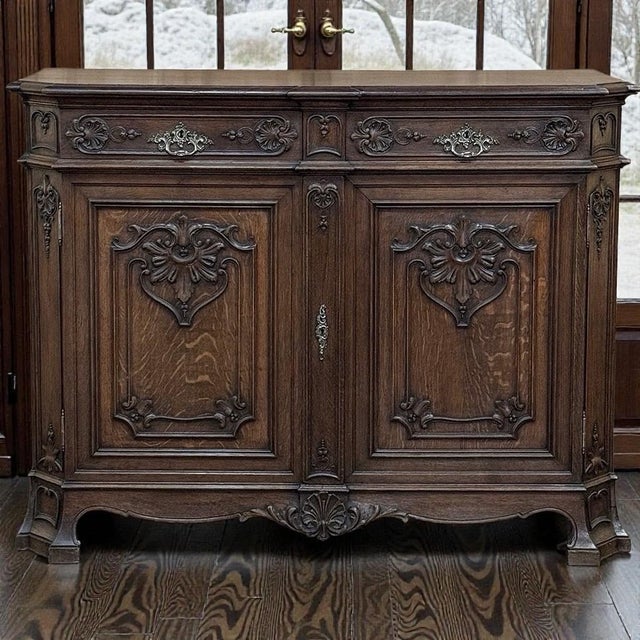 19th Century Liégeois Louis XIV two-door buffet reflecting the proud carving traditions of the Liège region, where...
