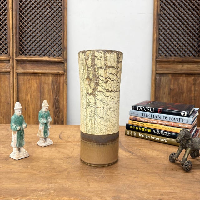"About This Piece About This Piece This vase speaks in the language of earth and time, a piece that looks as if it were...