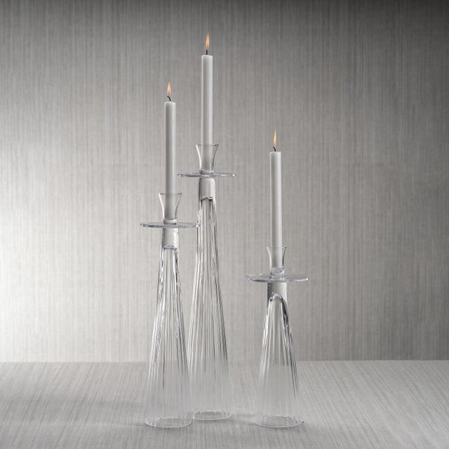 This sleek and stylish candle stand adds an elegant panache to the party decor. Features include unique modern shape of...