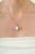 The Bohemian Natural Oval Rainbow Moonstone & Sterling Silver Filigree Pendant features a beautiful 5.68-carat Rainbow...