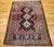 "A beautifully woven vintage Persian Afshar tribal area rug from the early 20th century, showcasing a bold and intricately...