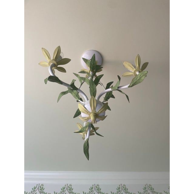 Lovely tole 3 light chandelier. Has been repainted with varying greens to enhance the leaf design. Perfect for a powder...