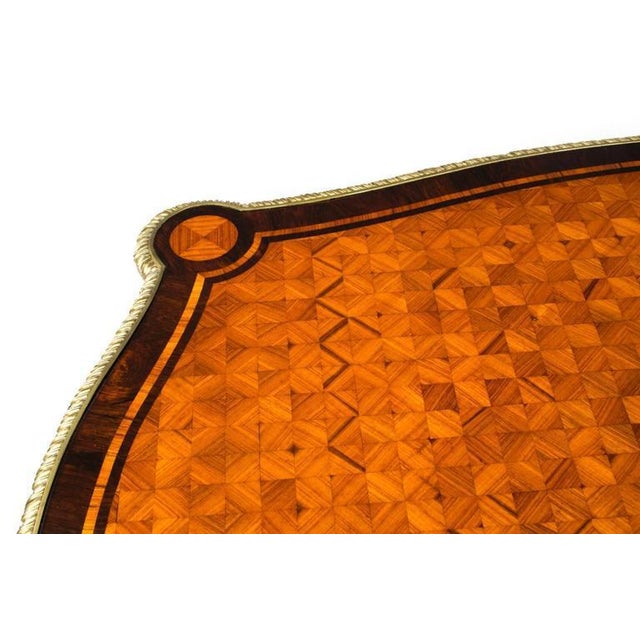 This is an antique bureau plat parquetry writing table of French manufacture dating from Around 1860. We are delighted to...