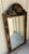 A striking vintage Italian Chinoiserie wall mirror featuring an elegant black lacquered frame embellished with finely...
