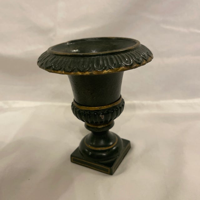 Diminutive classical urn with egg and dart design. Dark green with gold accents. Perfect for a floral or greenery ball.