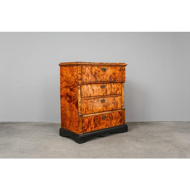 Item: Chest of drawers with secretary compartment Period & Style: Biedermeier - Mid-19th century Features - Elegant and...