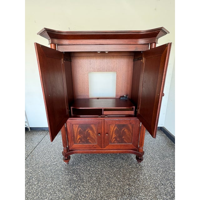 Very nicely kept Baker Milling Road Armoire Entertainment Unit from 1999. Beautiful mahogany wood with matching panels....