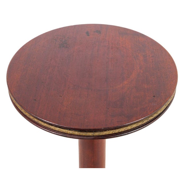 French Empire Style Gilt Metal Mounted Mahogany Pedestal, early 20th century, &nbsp;the circular top on a tapering column...