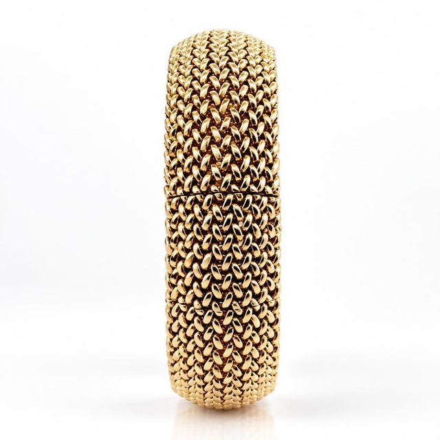 A masterpiece of mid-century glamour and secrecy, this magnificent wide woven cuff conceals a hidden watch beneath a...