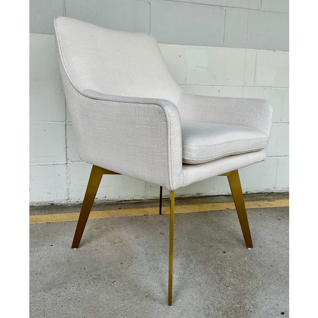 Timeless Revelation Mid-Century Modern Let’s Twist Swivel Chair, satin brass base, off-white woven fabric, memory swivel,...