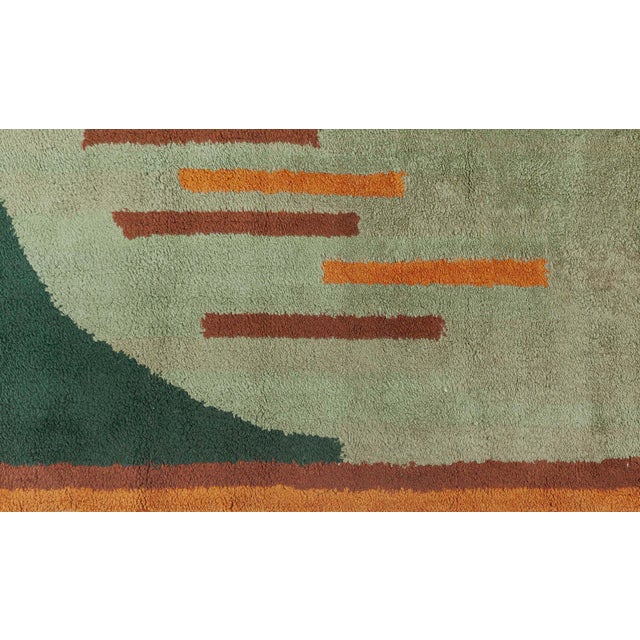 Vintage French Art Deco Rug Size: 7'4" × 9'0" (223 × 274 cm) Color: Brown, green, orange This striking French Art Deco rug...