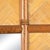 A vintage rectangular mirror framed in faux bamboo and wrapped rattan with herringbone-woven panels. The natural woven...