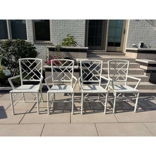 Offered is a vintage set of restored chinoiserie style metal dining chairs by Meadowcraft. This set has been...