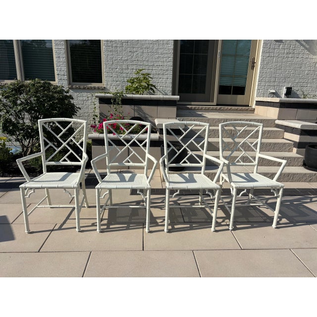 Offered is a vintage set of restored chinoiserie style metal dining chairs by Meadowcraft. This set has been...