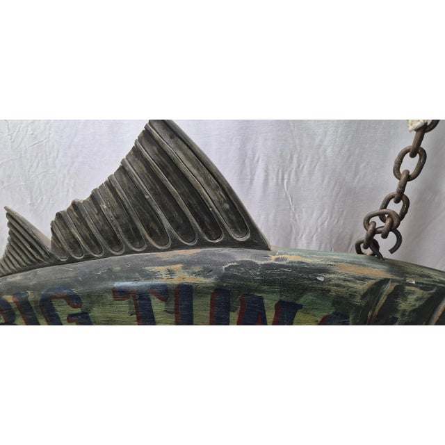 Six foot carved Atlantic tuna wood trade sign with lettering for "The Big Tuna" sushi bar. Letters are blue and red....