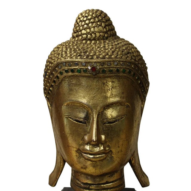 Master handcrafted Buddha head on stand, this statue is carved with solid wood painted with gold color, decorate with...