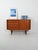 Compact teak sideboard with two compartments: sliding door with double offset shelf and column of drawers. Blade handles,...