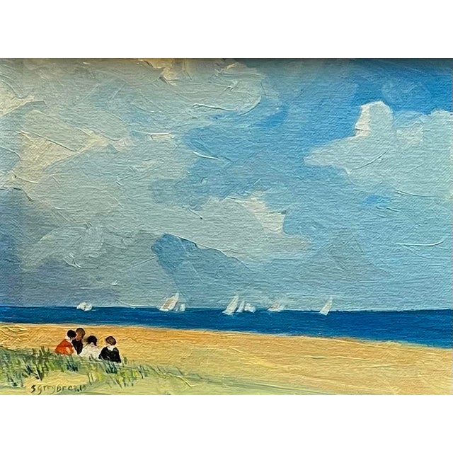 Oil painting on canvas board of children huddled together at the seaside with sailboats in the distance under a dramatic...