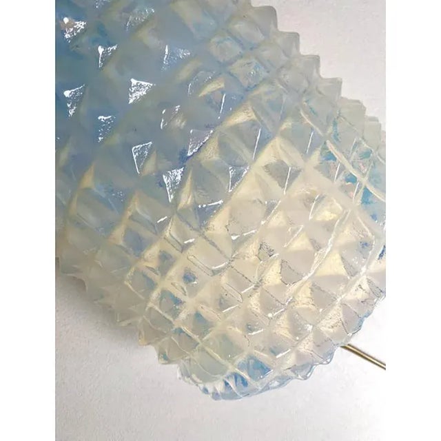 Impressive wall sconces in murano glass, with a crocodile texture of glass tht make it sparkling even when the light is...