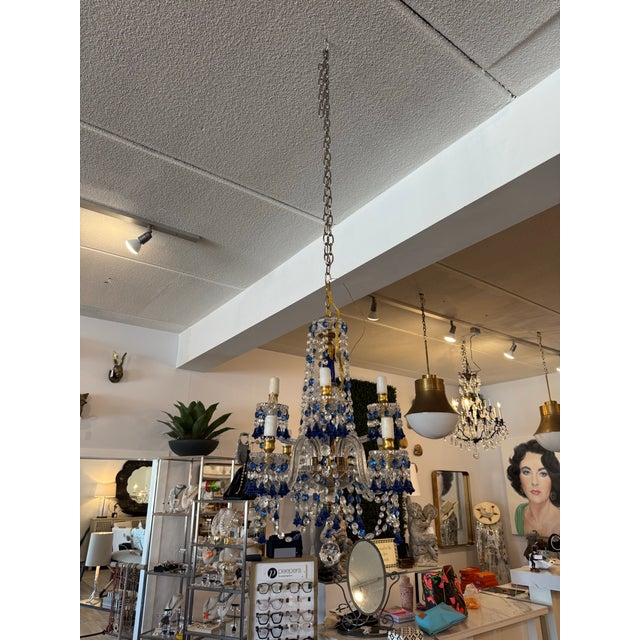 Add a touch of timeless elegance to any space with this beautiful petite vintage crystal chandelier, adorned with a...