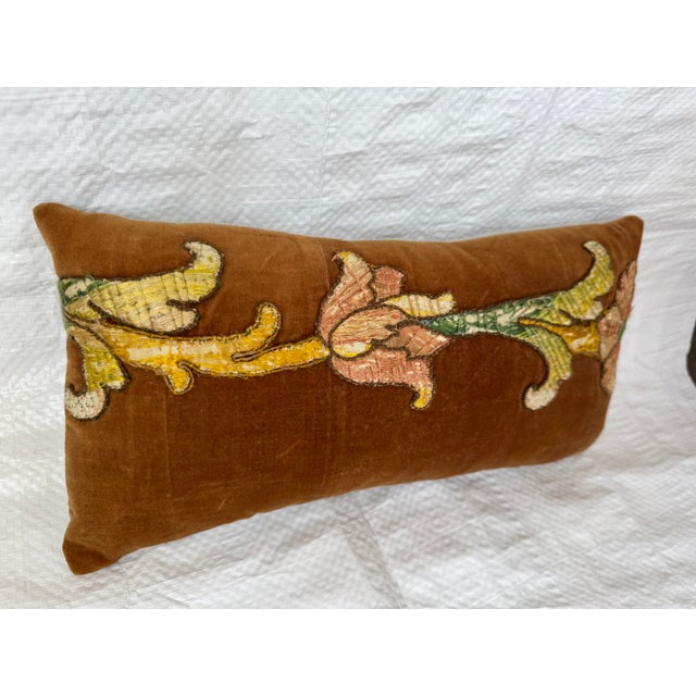 An opulent fragment of 17th-century Florentine textile art, this piece showcases masterful craftsmanship in deep crimson...