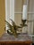 A wonderfully atmospheric vintage cast brass figural candlestick formed as a winged griffin (dragon/wyvern) holding a...