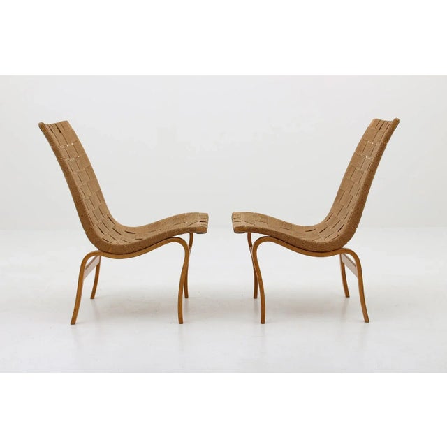 This gorgeous pair of 'Eva' lounge chairs was designed by Bruno Mathsson for Karl Andersson & Söner, Sweden, 1940s. This...