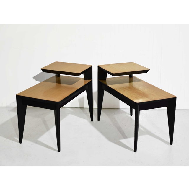 A classic atomic-era silhouette with a light, playful feel. This pair of 1950s mid century modern end tables features...