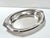 A classic vintage silver plate serving tray featuring sculptural floral handles, softly stepped edges, and elegant Art...
