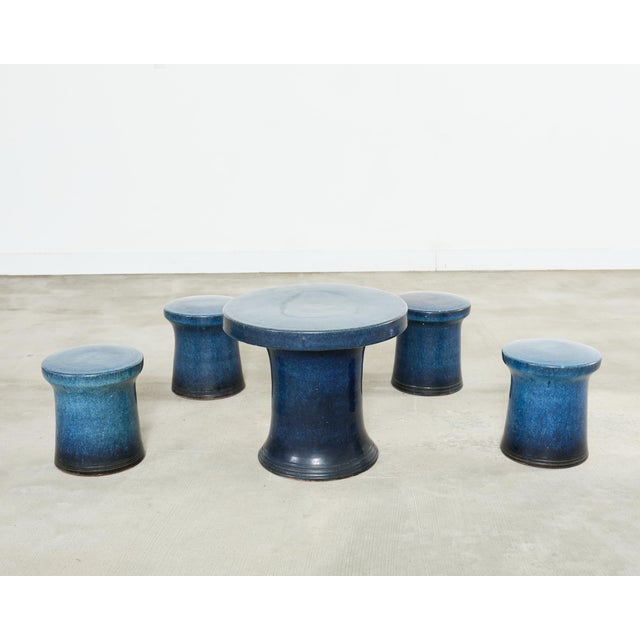 Distinctive Japanese Showa period patio and garden stool tea set crafted from glazed ceramic pottery. The set consists of...