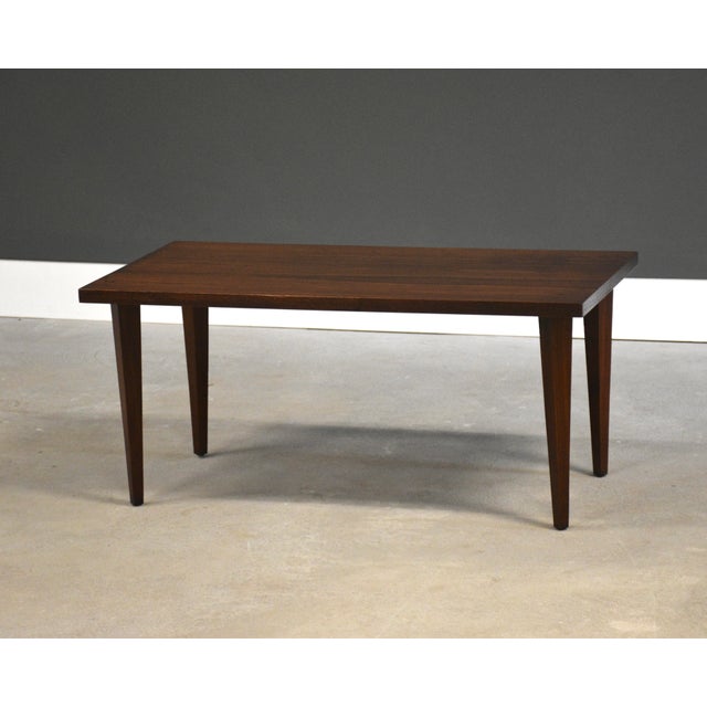 A mid century modern walnut side table or coffee table. Circa 1960’s. Made in USA. Professionally refinished. Unsigned....