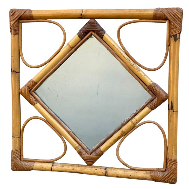 1970s Rattan Mirror. Handcrafted in the South of France. Add a retro touch to your interior with this square vintage...