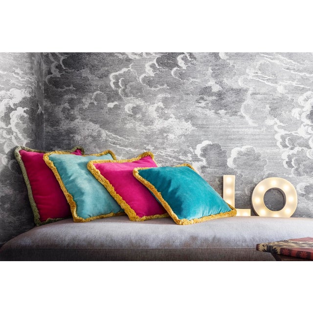 The Happy Pillow in light blue and yellow is part of a collection from Lo Decor of soft velvet cushions with a contrasting...