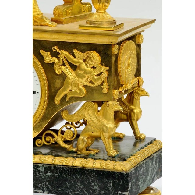 This refined Empire-period clock, dating to around 1810, features a case created by the atelier of André-Antoine Ravrio....