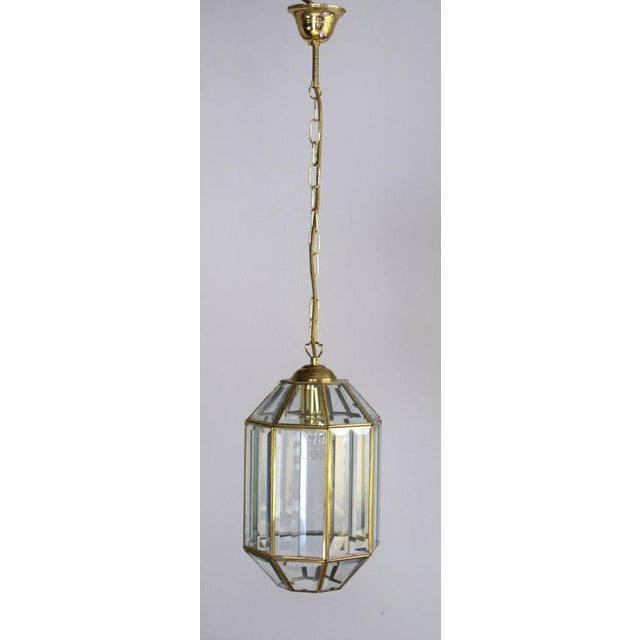 Ceiling pendant light made of brass and cut glass. High-quality craftsmanship. Molded circa 1960. Height of glass shade:...
