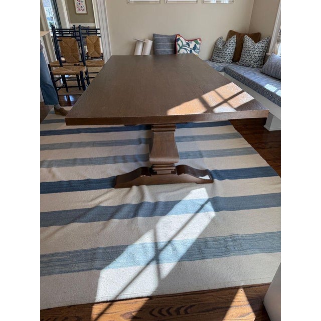 Well-loved trestle table featuring beautifully shaped balusters in a dark wood stained finish. Subtantial without...