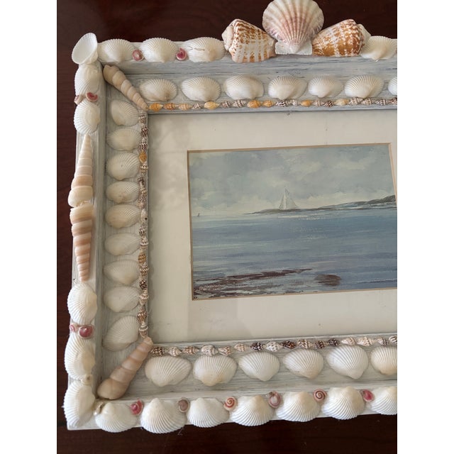 Beautiful coastal art print in a handmade seashell frame.