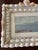 Beautiful coastal art print in a handmade seashell frame.