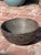 An old, decorative wooden bowl is carved from one piece of wood from the Tuareg people of Niger. The Tazawat milk bowl has...