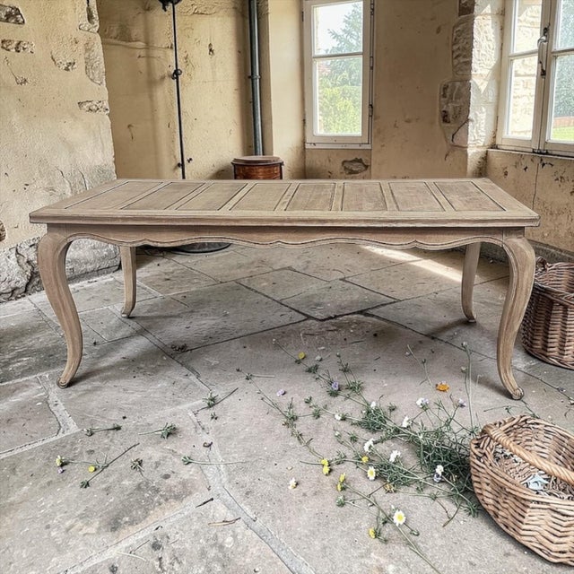 Hand-crafted from beautifully grained fruitwood, this elegant Country French dining table reflects the quiet refinement of...