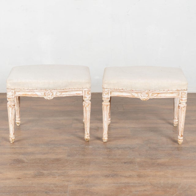 Pair of early 20th century Swedish taboret stools crafted in pine. Each stool features turned, tapered, fluted legs and...