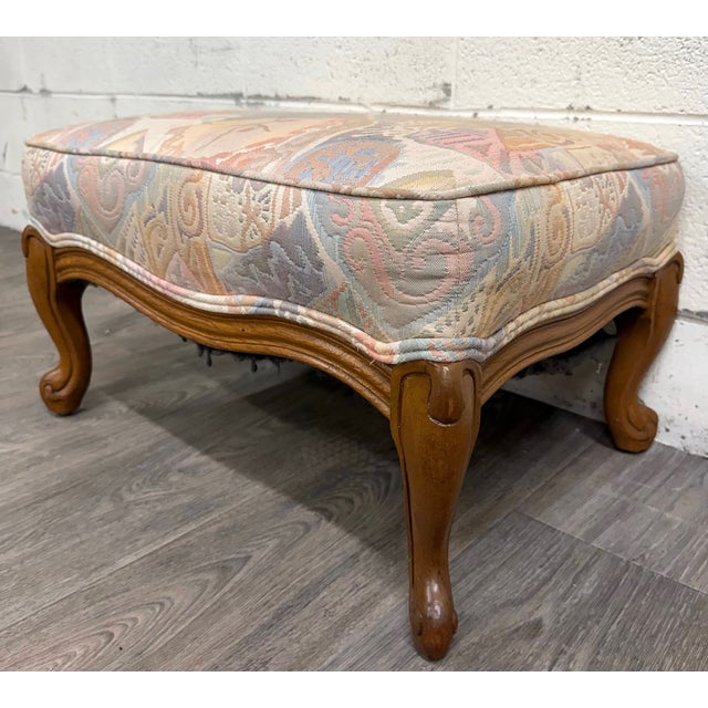 This is an absolutely gorgeous French Louis XV French Country carved ottoman with abstract fabric. Features carved...