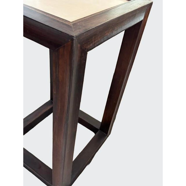 An transitional side table with hand inlay cream colored lacquer top, and dark asian inspired wood frame. Signed and...
